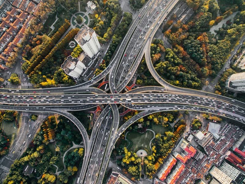 Aerial view of a major motorway junction threading through the landscape