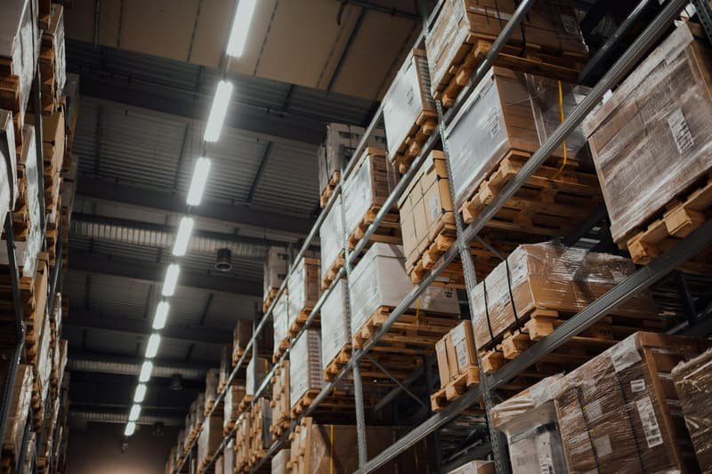 Racked goods under low warehouse lighting at the end of the working day
