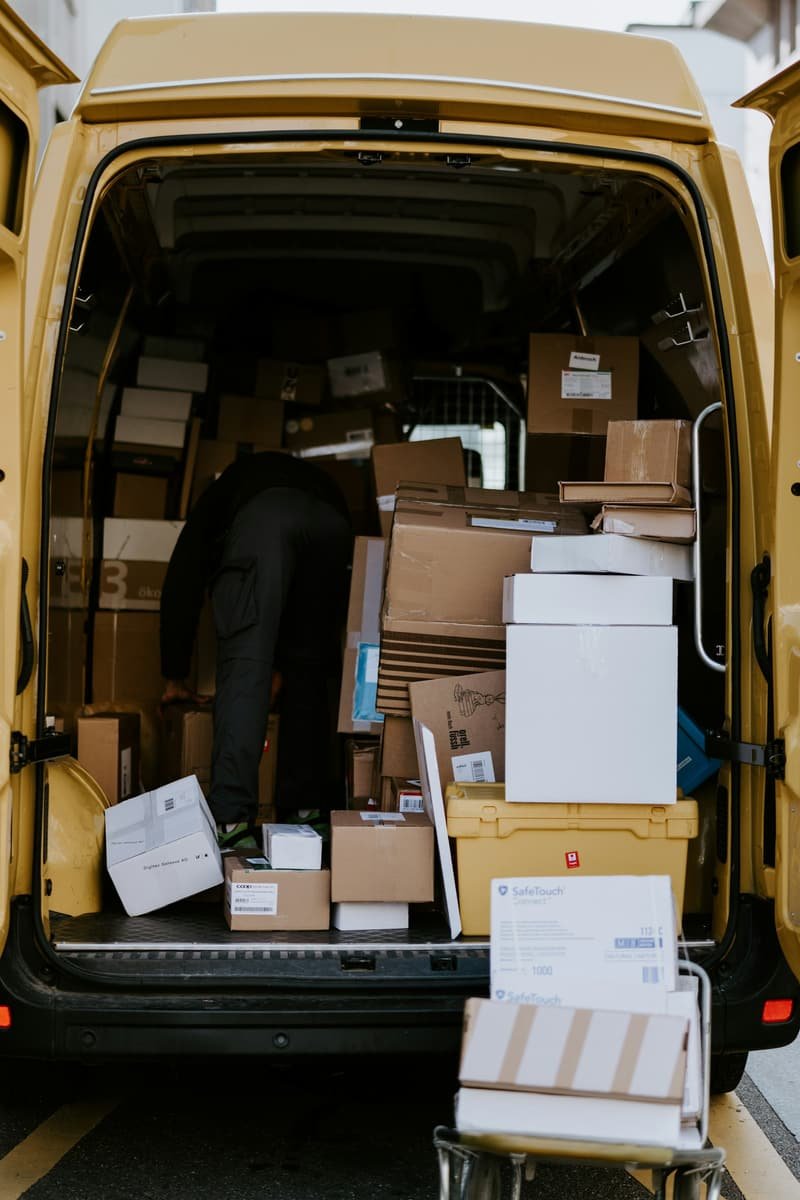 Household boxes loaded with care into a moving van