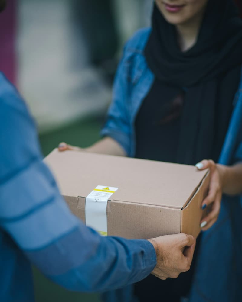 Documents package passed directly from one pair of hands to another